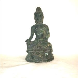 Iron Buddha Meditating Sitting in Lotus Position.